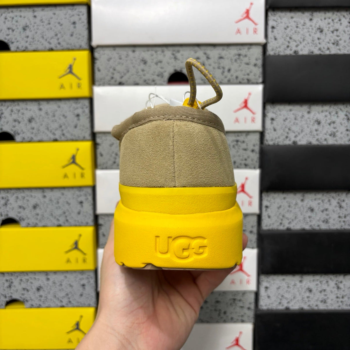 UGG Neumeel Deco Slip-On – Suede Moccasin Sneaker with Yellow Lug Sole & Carabiner Collar in Sand